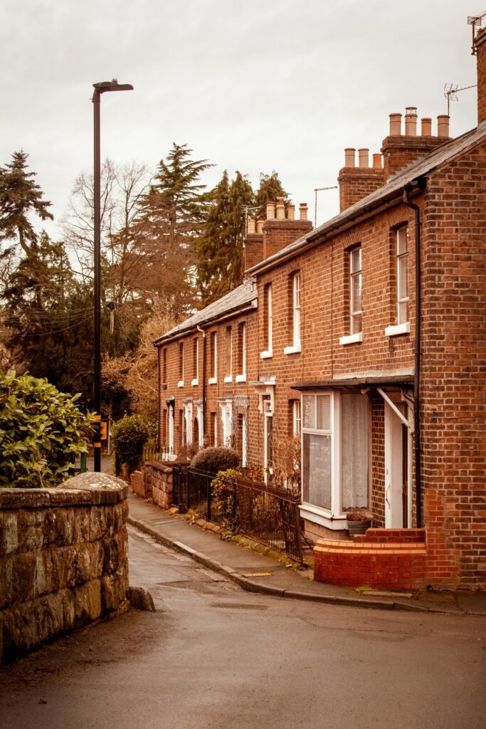 Picturesque row of brick houses on a quiet street in Shrewsbury, England, with a timeless charm.